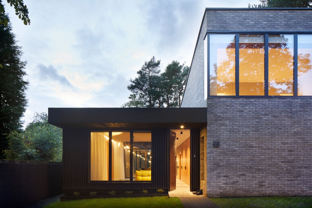 The brick facades are teamed with portions of vertically slatted timber