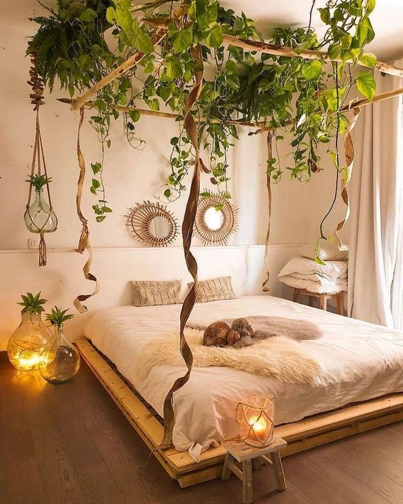 a jaw-dropping bedroom with greenery suspended to the ceiling feels relaxing and a very comfortable