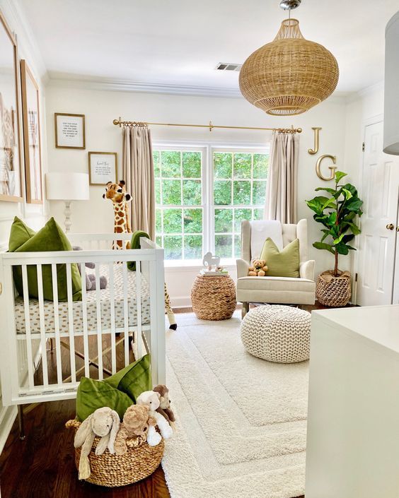 a welcoming neutral nursery with bold green textiles, a rattan lamp and woven ottomans plus a cool rug