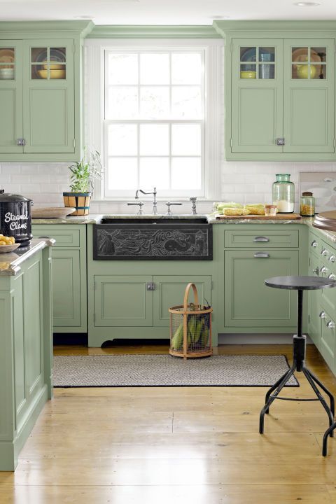 07 a welcoming sage green vintage kitchen with a white tile backsplash, grey stone countertops and a dark sink is wow
