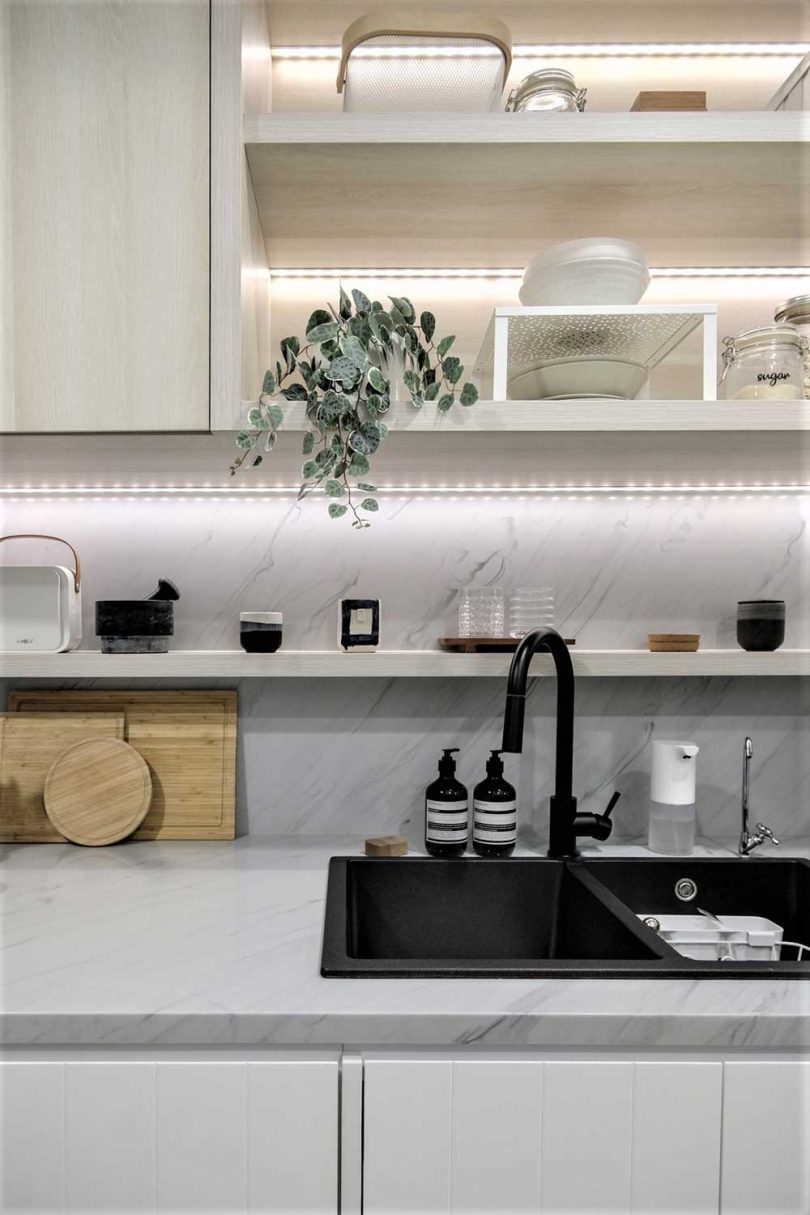 Smart built-in lights visually expand the space and the use of neutral colors only is for the same