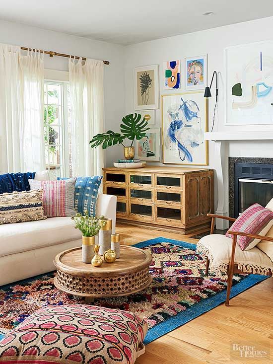08 a global style living room in neutrals but with colorful and printed textiles and a bold gallery wall