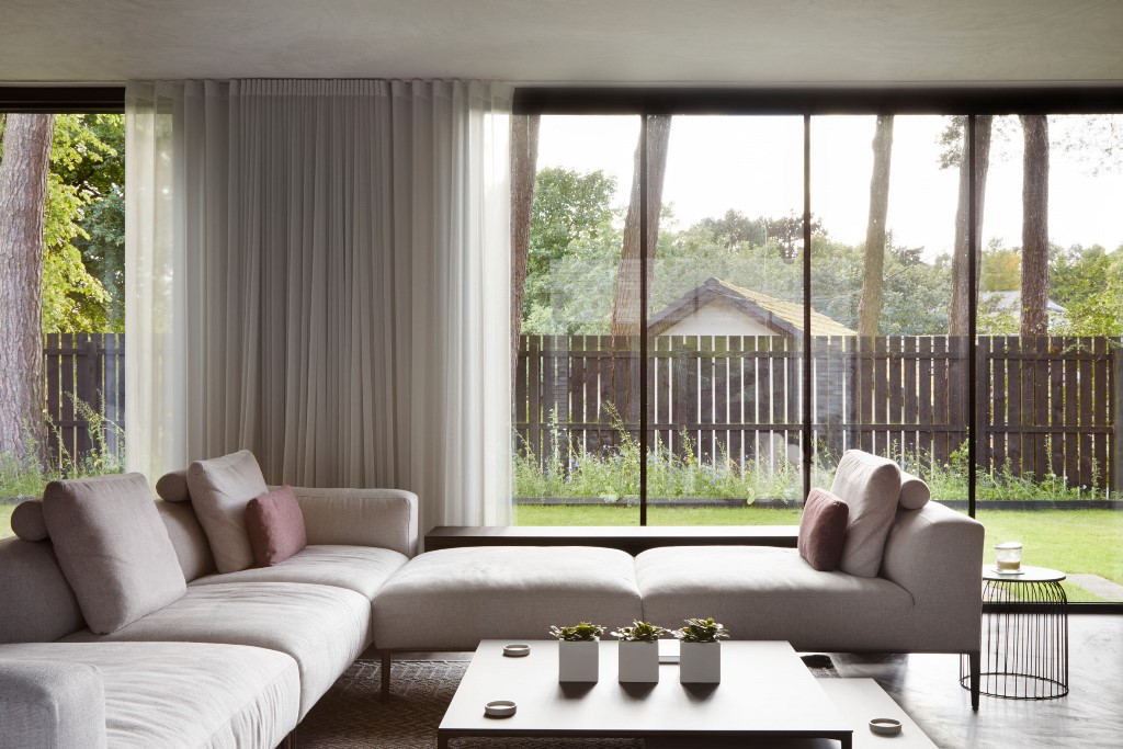 Muted furnishings help retain focus on the building materials and views outside