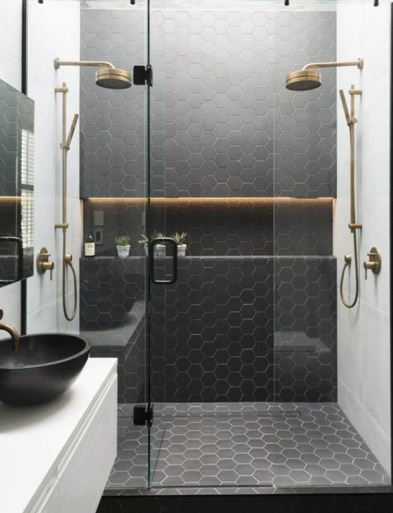 10 a stylish contemporary bathroom with white square tiles and black hex ones plus brass touches and fixtures