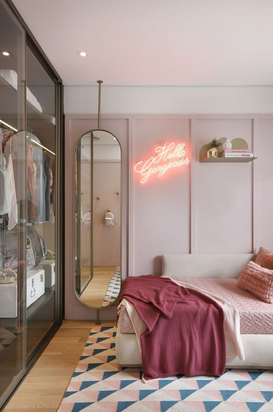 13 a modern and fashionable girlish bedroom in pink, with elegant furniture and a glass closet with sliding doors