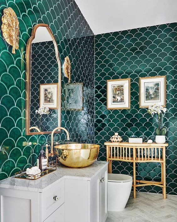 13 an emerald fish scale tile bathroom, with white appliances and gold touches here and there is very elegant