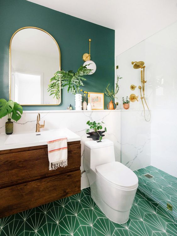 15 a chic modern bathroom with a green wall, white marble, a green printed tile floor, a floating wooden vanity