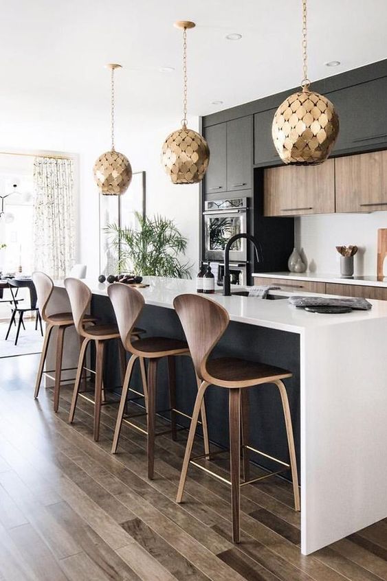 19 a stylish black and white contemporary kitchen with jaw-dropping gold scale pendant lamps is jaw-dropping