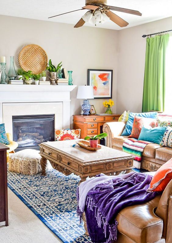 a bright global style living room with colorful printed folksy textiles, bright artworks and a decorative woven plate