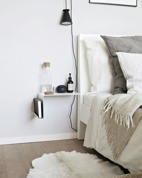 21 a catchy minimalist nightstand in white, with a book stored and some stuff on top is very airy and cool