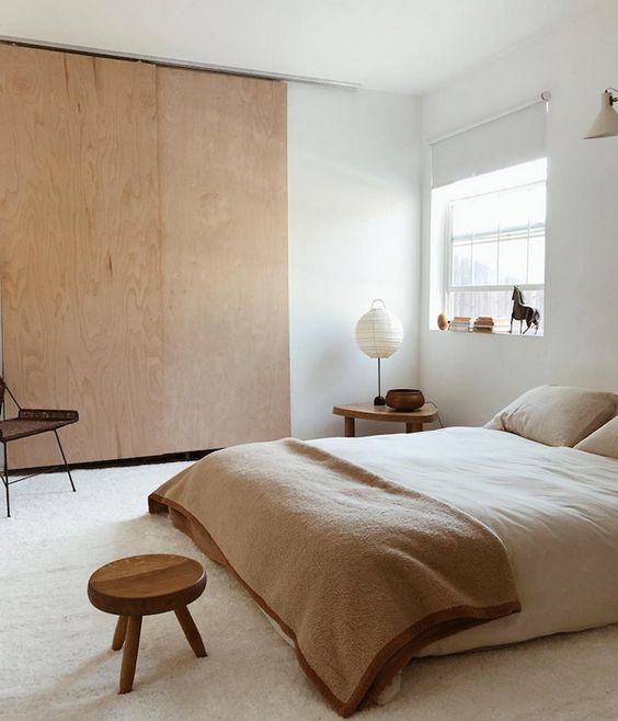 22 a Japandi bedroom in neutrals feels very welcoming, airy and cozy and looks simple and chic at the same time