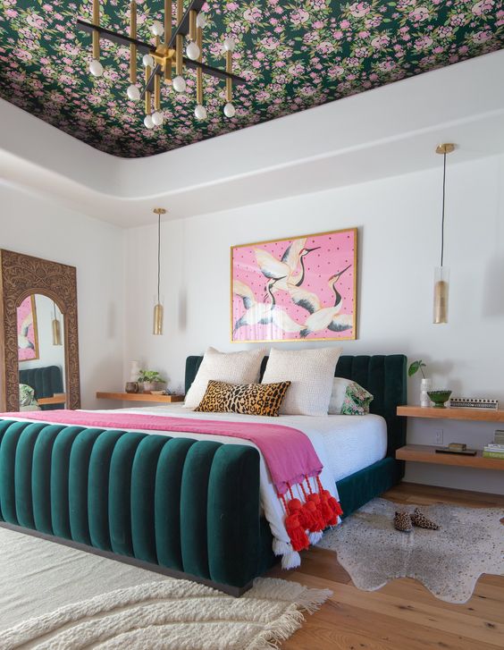 22 a refined and chic modern colorful bedroom with a floral ceiling, a hunter green bed and pink touches is cool