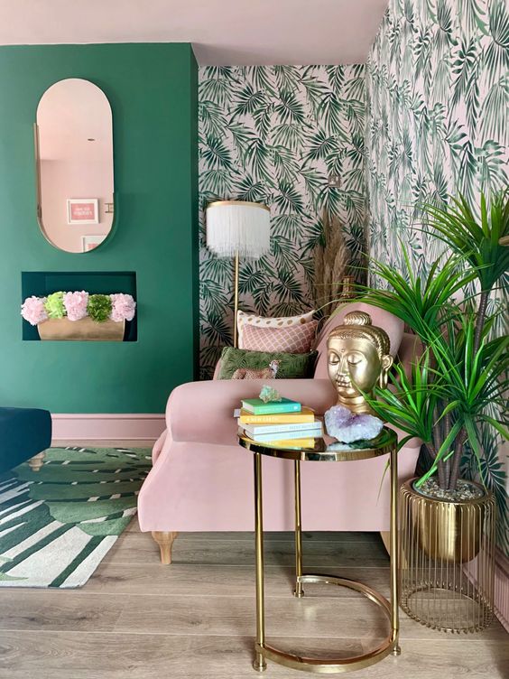 a cheerful living room in green and pink, with tropical wallpaper, pink furniture and green walls