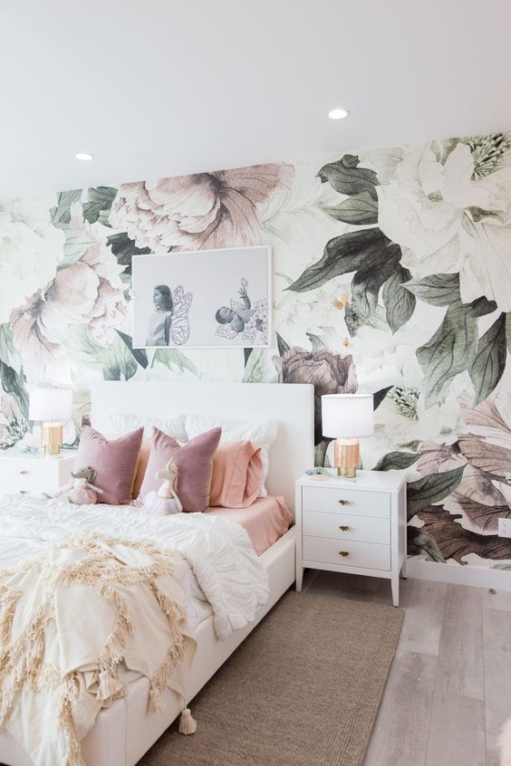 35 a dreamy bedroom with a pastel floral mural, white furniture, an artwork, white lamps and pastel bedding