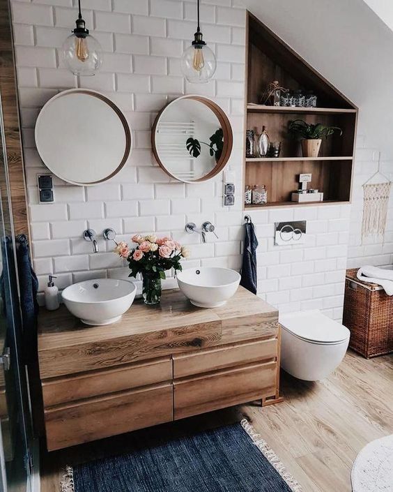 35 a small and cozy bathroom clad with white subway tiles, a floating vanity and a niche done with wood plus white appliances