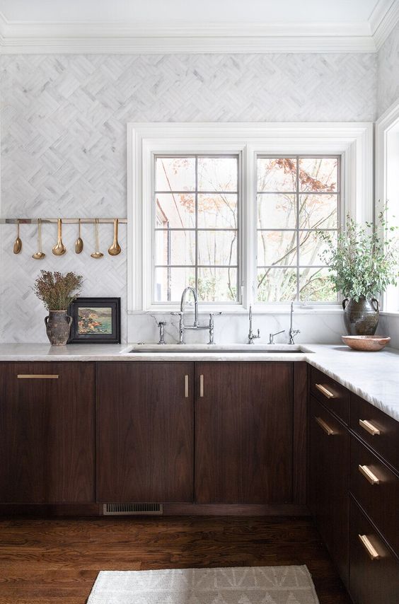 42 a jaw-dropping walnut kitchen with white stone countertops and white marble tiles plus touches of gold