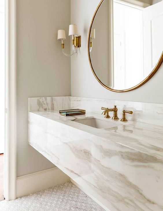 45 a refined neutral bathroom with a white marble slab vanity plus brass touches for a more exquisite look