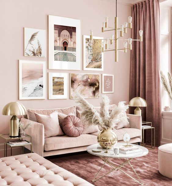 52 a refined monochromatic pink living room with elegant furniture, a gold chandelier, pampas grass and a cool gallery wall