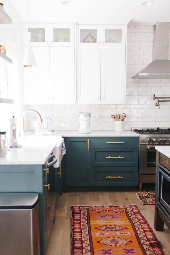 63 a stylish modern two tone kitchen with white and teal cabinets, a white subway tile backsplash, white countertops and a matching kitchen island