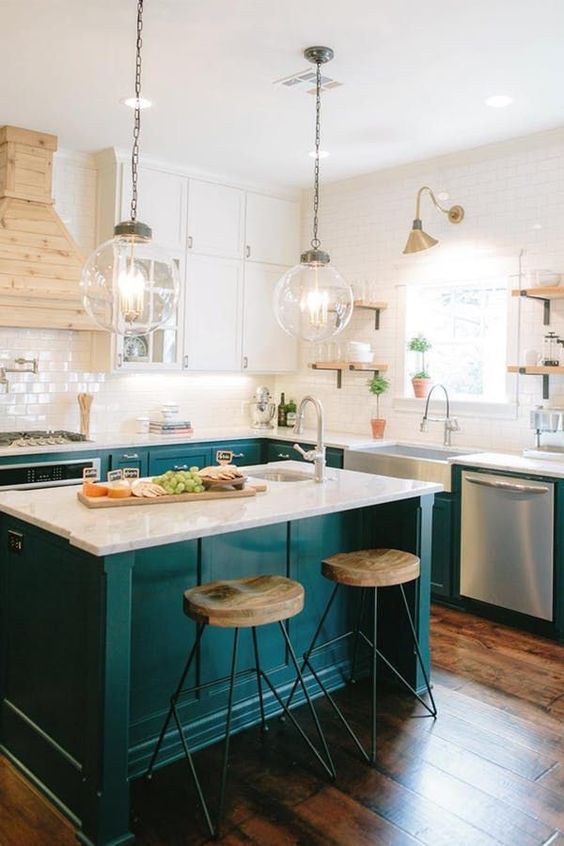 67 a welcoming farmhouse kitchen with white and emerald kitchen, a white subway tile backsplash and a wooden hood