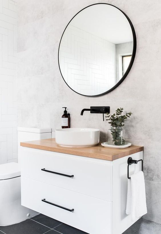76 a compact white floatign vanity with a stone countertop will give you some storage space without taking any floor space