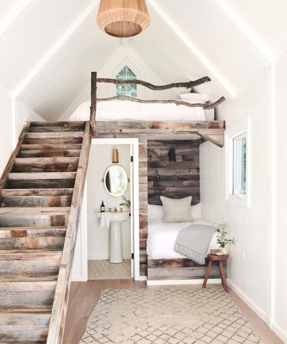 A little rustic apartment with a two bedrooms   a usual and a loft one, a bathroom and a pretty reclaimed wood staircase