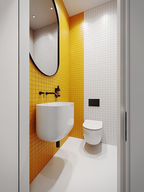 a minimalist bathroom with a yellow tile accent wall, black fixtures and a black frame plus white appliances looks bold