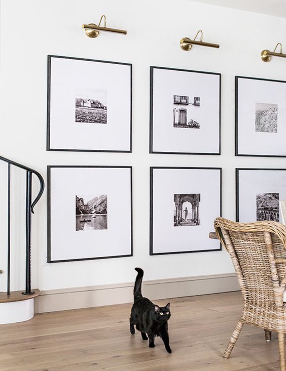 02 a statement grid gallery wall with matching black frames and black and white artworks with matting is a stylish idea to rock