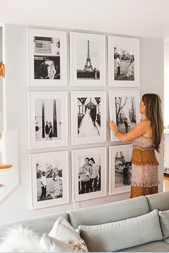 07 a chic grid gallery wall with matching white frames and black and white family pics is cool