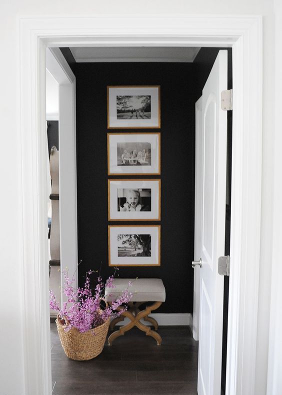 10 a cool one row grid gallery wall with stained wooden frames and black and white family pics – the shape gives the gallery wlal a modern look