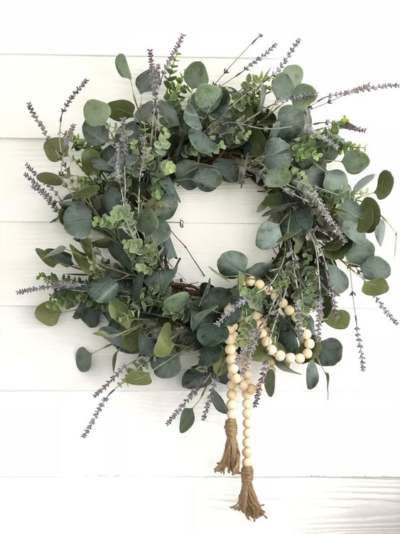 11 a gorgeous artificial lavender and eucalyptus wreath with wooden rosery is a lovely and very fresh idea for spring