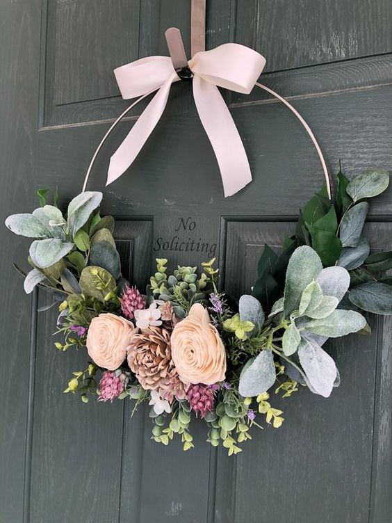28 a pretty modern spring wreath with greenery, pink and blush blooms and a blush ribbon bow on top is a lovely idea