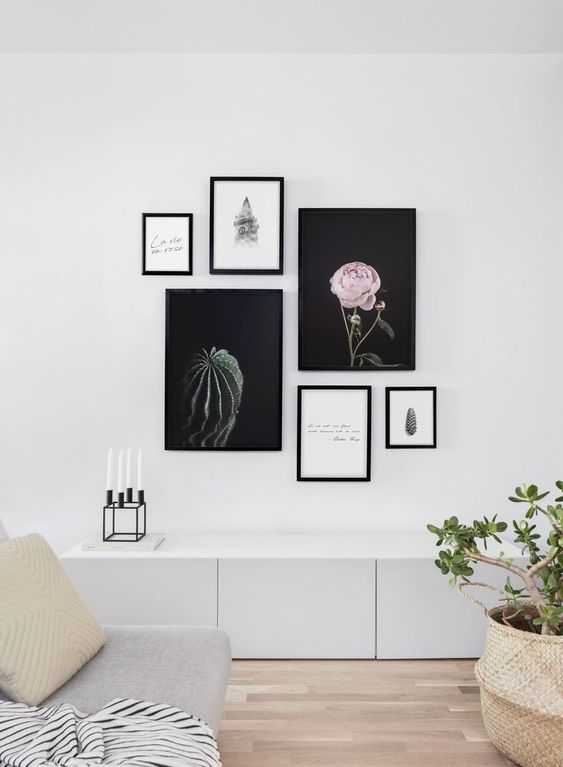29 a modern free form gallery wall with mismatching frames and no frame art, with beautiful artsy posters