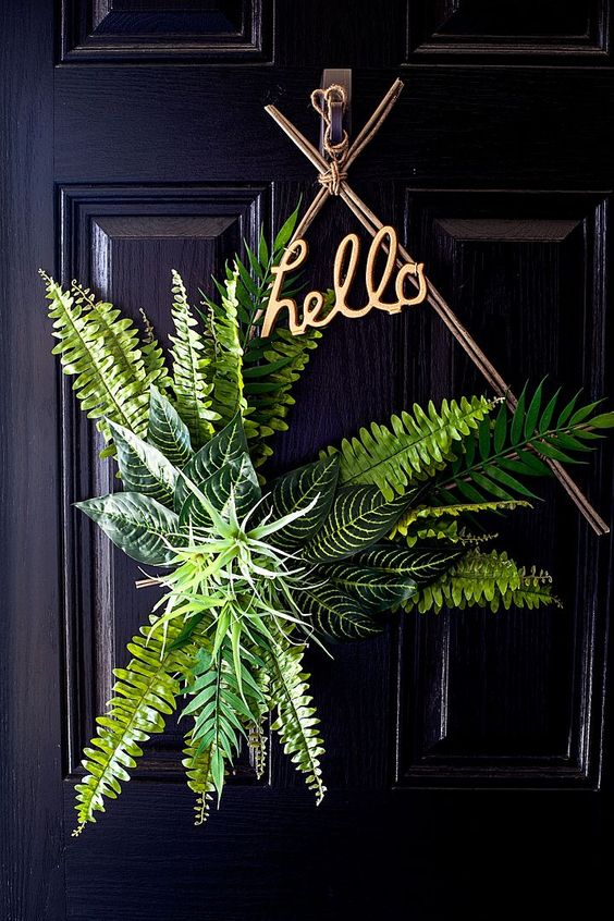 a fresh boho spring wreath of branches, greenery and air plants plus a HELLO calligraphy piece is amazing