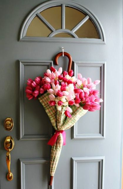 a plaid umbrella with pink and blush tulips is a pretty alternative to a usual spring wreath