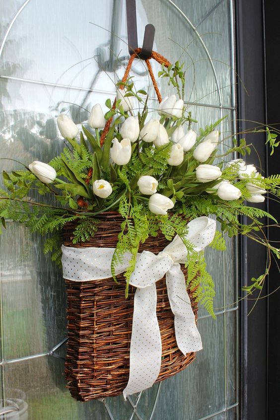 53 a basket with ferns, white tulips, a polka dot ribbon bow is a lovely alternative to a usual spring wreath