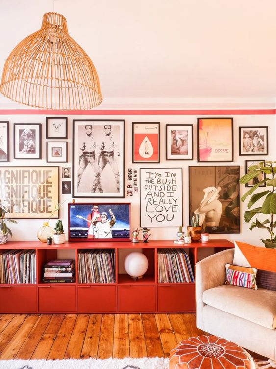 a bold gallery wall with colorful art in mismatching black frames will bring a touch of color and an artful feel