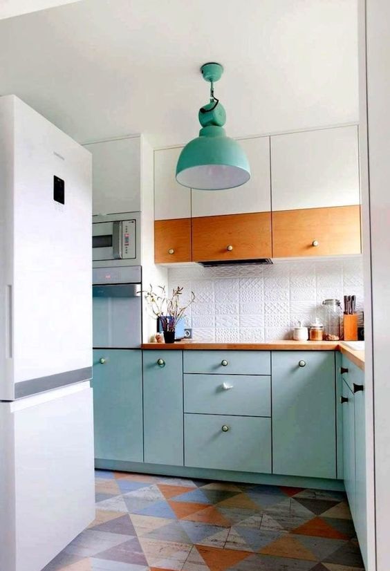 a bright Scandi kitchen in white and turquoise, with a patterned tile backsplash and stained wood