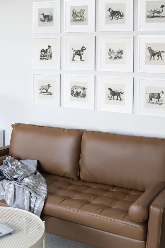 A catchy grid gallery wall with vintage dog pics is a unique solution and a great idea for a dog lover home