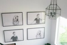 a cool black and white grid gallery wall with black frames shows off kids’ pics and adds fun and coziness to the space