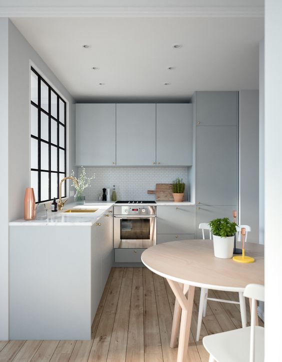 a grey contemporary kitchen with white stone countertops, a French frame window and a round table