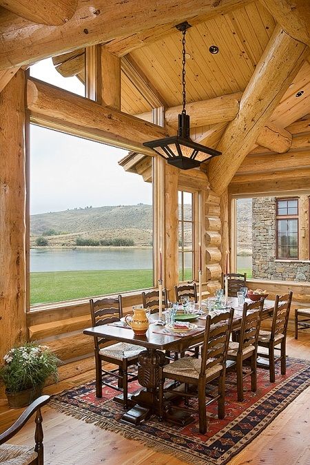 a log cabin with large windows to enjoy the views and clerestory windows for more light and a more modern feel