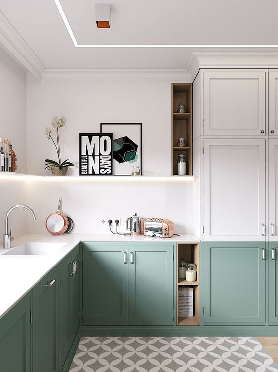 A modern two tone L shaped kitchen with built in light and white stone countertops is a chic space