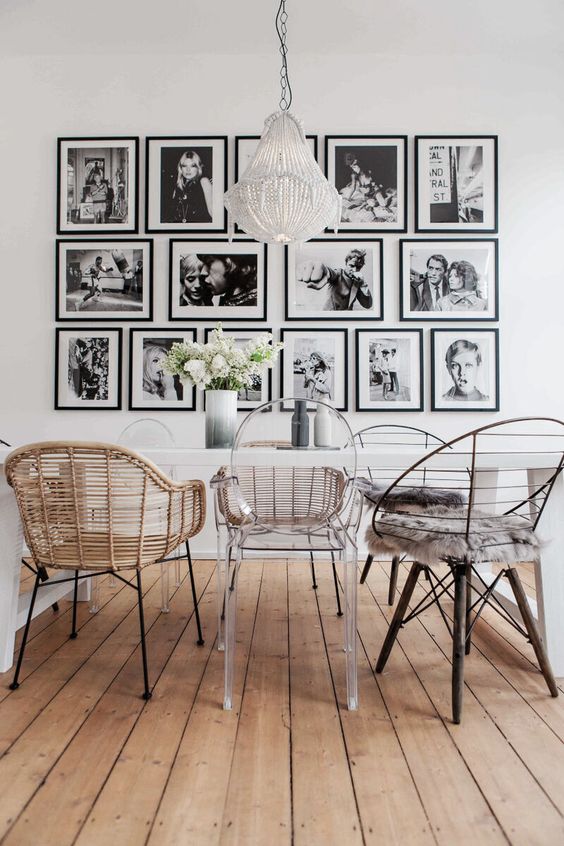 a stylish gallery wall with matching black frames and black and white farmily pics is a very cool idea to enjoy