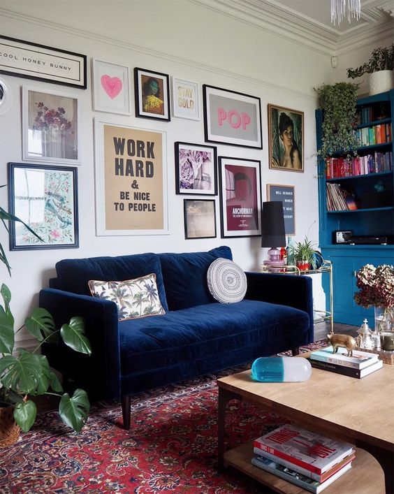 an eclectic gallery wall with mismatching art, frames and prints is a beautiful idea to go for