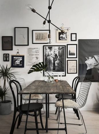 an elegant monochromatic gallery wall in black, white and neutrals, with prints and photos that inspire and impress