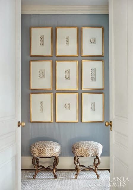 an exquisite gallery wall with gilded frames, much matting and matching decorative objects inside is a cool idea