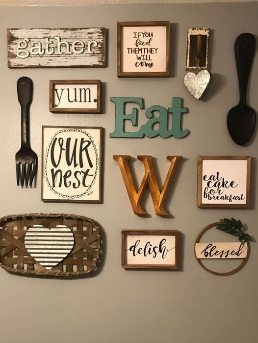 03 a lovely kitchen gallery wall with letters and monograms, signs in frames, pretty cutlery and a tiny wreath with greenery