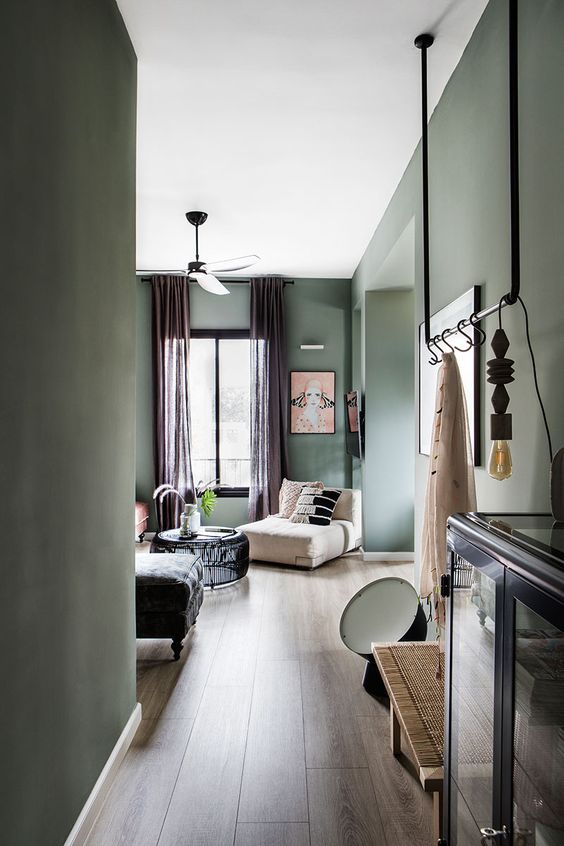 12 a beautiful Scanndinavian home with light green walls, various chic furniture, mauve curtains, black dramatic touches