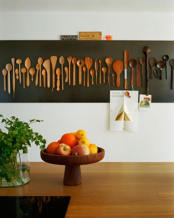 lovely rustic kitchen wall decor with stained wooden spoons, with an ombre effect from the lighter to the darker shade